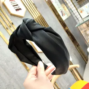 Black fabric knotted headband for women, wide brim hair hoop, chic Korean style hair accessory.