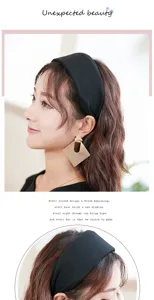 Close up view of women wide black knitted headband detail showing elegant daily wear style.