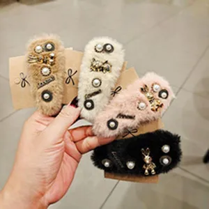 Plush fuzzy hair clips with elegant pearls and cute charms, perfect for sweet daily styles.