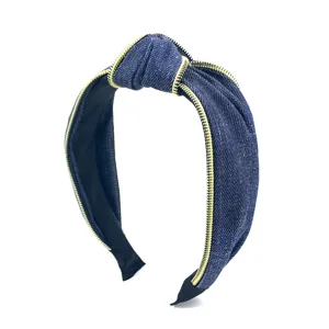 Fashion denim knotted headband with gold zipper trim, stylish wide hair hoop for women.