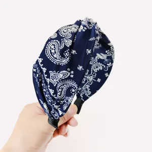 Navy blue paisley printed knotted headband, stylish wide fabric hair hoop for women and girls.