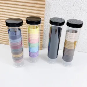 Elastische Haargummis für Damen, langlebige Haarbänder in transparenten Tuben verpackt.
