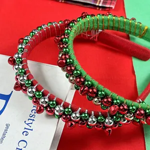 Detailed close-up of Christmas velvet headbands featuring colorful jingle bells and beads.
