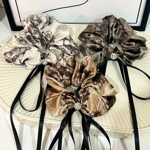 Vintage Chinese ink print hair scrunchies with black ribbons and crystal rhinestones for elegant use.