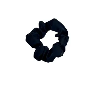 Elegant black hair scrunchie for women, soft elastic hair tie and daily hair accessory.