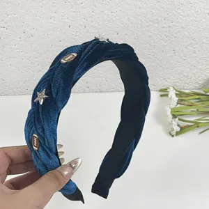 Wide velvet braided headband with star charms, cozy autumn winter hair accessory for women detail view.