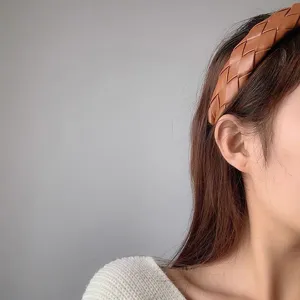 Chic brown braided leather headband for women, wide woven hair hoop stylish hair accessory.