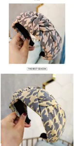 Close-up of retro houndstooth knotted headband stylish hair hoop for women everyday wear