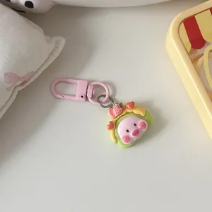 Cute strawberry pig keychain detail, kawaii resin cartoon bag charm accessory for gifts.