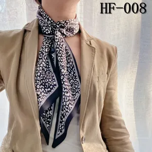 Chic black and white leopard print long silk scarf, perfect for styling with suits or bags.