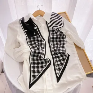 Chic black and white printed long silk scarf ribbon detail view, elegant neckerchief style.