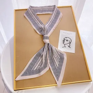 Elegant long silk scarf for women, chic geometric print ribbon neckerchief for spring.