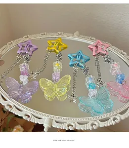 Detailed view of Y2K star butterfly hair clips with beaded tassels in vibrant pastel colors.