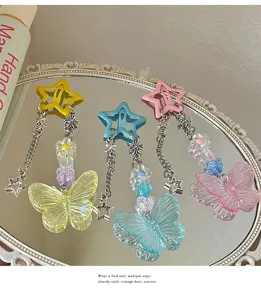 Y2K dopamine star butterfly hair clip detail view, featuring cute resin butterflies and chains.