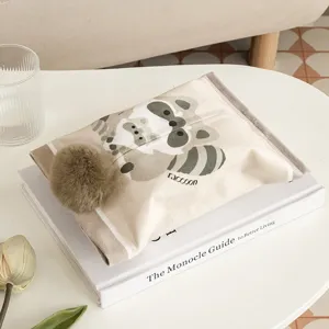 Fabric tissue box cover with cute raccoon pattern and fluffy pompom for home and car decor.