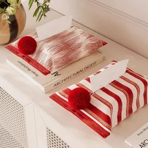Modern minimalist tissue box cover with red pompom, striped napkin holder for home desk.