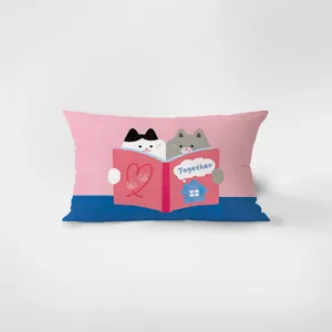 Close-up detail of the soft rectangular cushion featuring a cute cartoon cats reading book design.