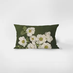 Detail view of rectangular lumbar pillow with botanical white floral art on green flannel.