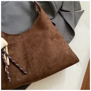 Brown suede shoulder bag for women, large capacity underarm handbag with chic drawstring.