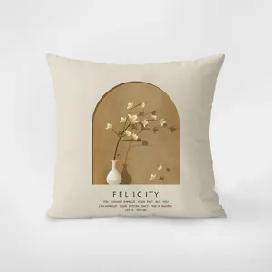 Beige velvet throw pillow detail showing modern minimalist arch botanical print and inspirational quote text.