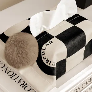 Black and white checkered tissue box cover with plush pom pom, French luxury style home decor.
