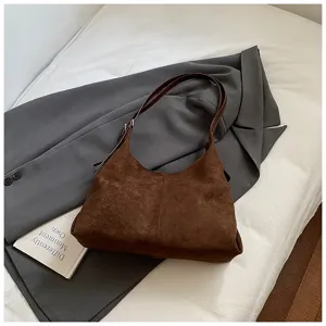 Brown suede hobo shoulder bag detail shot, vintage style casual daily handbag accessory view.