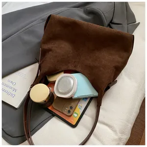 Brown suede shoulder bag for women, large capacity underarm hobo handbag for daily use.