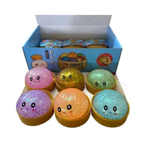 Kleurrijk glitter squishy broodje decompressiespeeltje met schattig gezicht en doos.