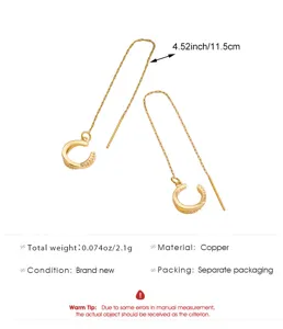 Detailed view of long chain ear cuff earrings, copper material with crystal, delicate and stylish.