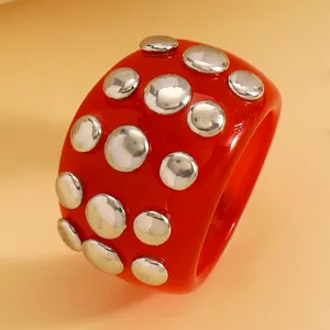 Red resin chunky bracelet with silver studs punk style fashion statement jewelry piece detail