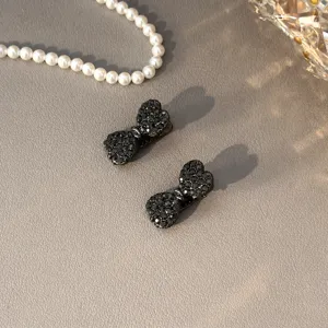 Exquisite black rhinestone bow hair clips for women, sweet versatile hair accessories for styling.