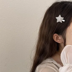 Sparkling rhinestone star hair clip detail shot showing crystal design for elegant styling.