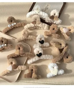 Cute plush hair claws with hearts and pearls, fluffy autumn winter hair accessories detail.