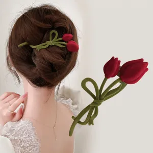 Detailed view of elegant velvet tulip hair clip showing exquisite floral updo accessory.