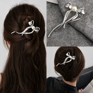 Elegant silver snake ribbon hair claw clip with pearl detail for stylish women daily updos.