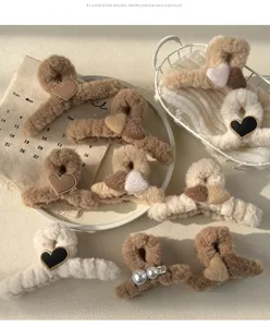 Fluffy plush hair claw clips with cute heart and pearl designs for stylish autumn winter.