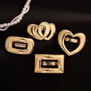 Gold alloy hair clips set featuring elegant heart and geometric designs, perfect women styling.