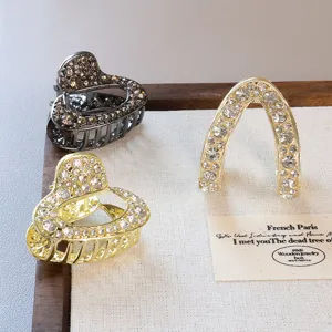 Rhinestone crystal hair claws set, metal heart and U-shaped hair clips for women's styling.