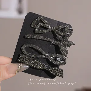 Elegant rhinestone bow hair clips set, sparkling crystal barrettes for women daily wear.