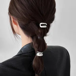 Minimalist metal ponytail cuff and hair clip set, sleek irregular silver hair accessory for women.