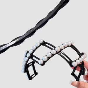 Detail close-up shot of the expandable folding pearl headband, highlighting flexible design.