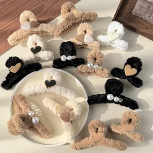 Fluffy winter hair claw clips featuring cute hearts and pearls, perfect hair accessories for women.