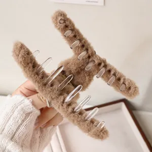Brown plush hair claw clip for women, fluffy winter shark clip hair styling fashion accessories.