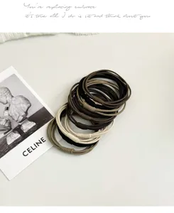 Detail view of neutral elastic hair ties set, high stretch ponytail holders for daily wear.
