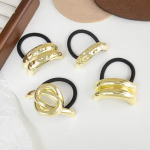 Minimalist gold metal geometric hair ties set, black elastic ropes for elegant ponytail styling.