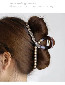 Large hair claw clip for thick hair, elegant pearl and rhinestone design, detail view.