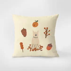 Close-up detail of beige Nordic throw pillow showcasing cute dog and autumn motif.