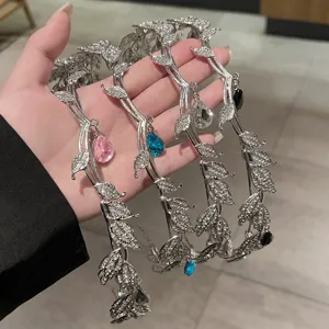 Shiny rhinestone leaf hairband featuring hanging teardrop crystal for party and wedding styling.