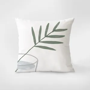 Close-up detail of soft velvet throw pillow featuring green botanical leaf and glass art print.