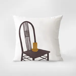 Detailed view of white throw pillow featuring minimalist retro chair illustration, cozy decor.